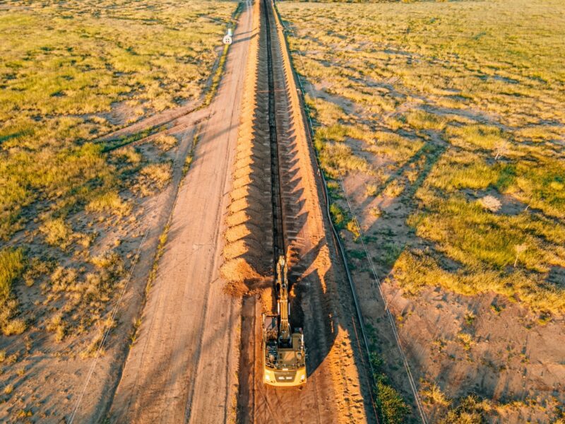 An autonomous excavator prepares trenches for a pipeline installation in Queensland, Australia.