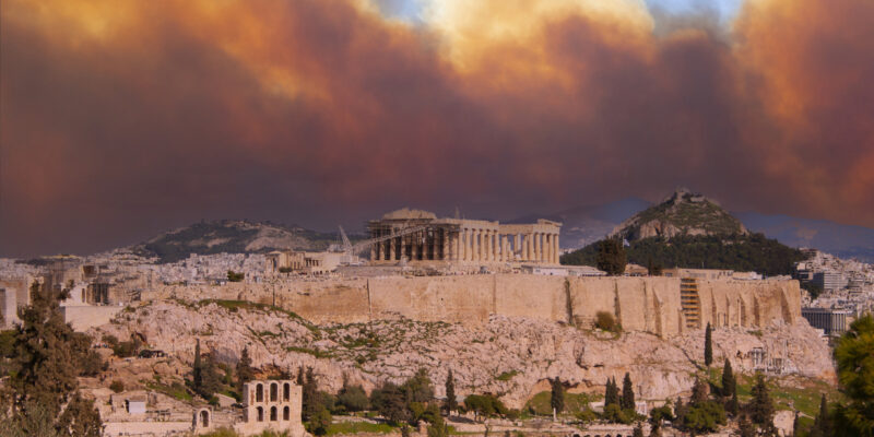 View of the Acropolis and Parthenon against the backdrop of smoke from fires in Athens, Greece