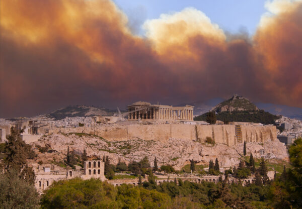 View of the Acropolis and Parthenon against the backdrop of smoke from fires in Athens, Greece