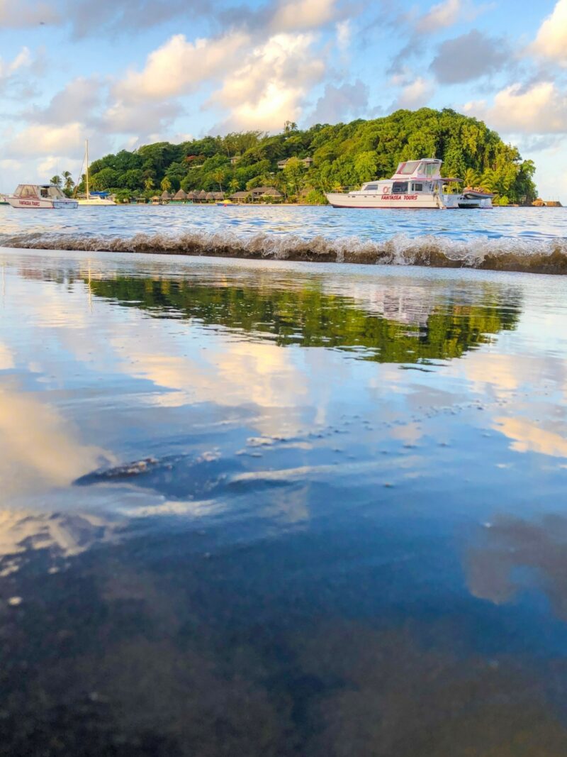 Boat, beach, building in Arnos Vale, Saint Vincent and the Grenadines by Winston Chen